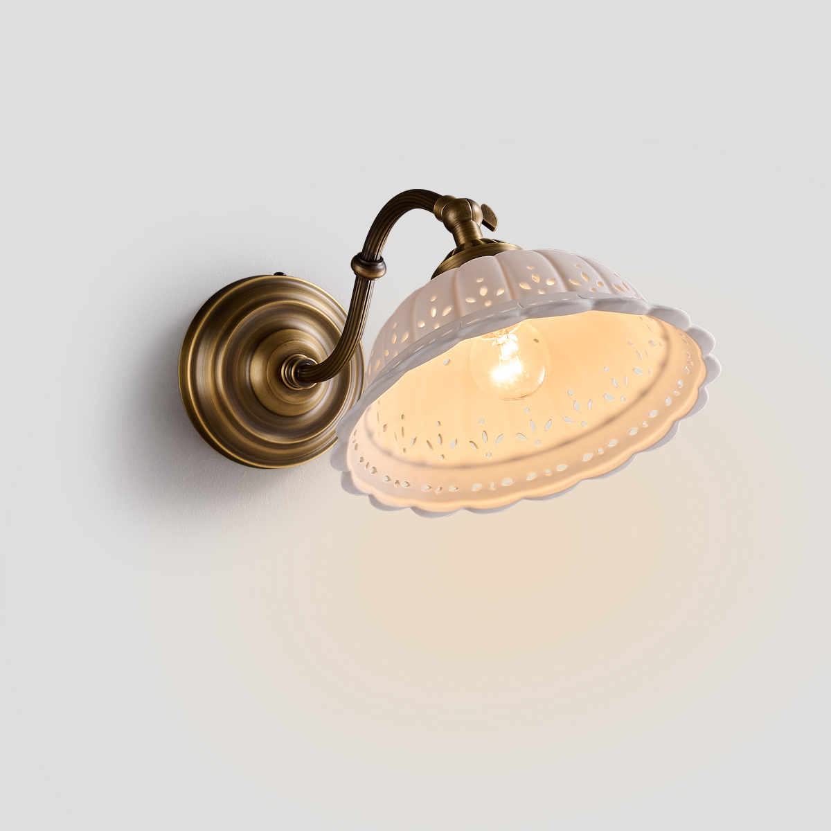 French Country Wall Sconce 1 French Country Wall Sconce with antique brass arm and scalloped pierced ceramic shade