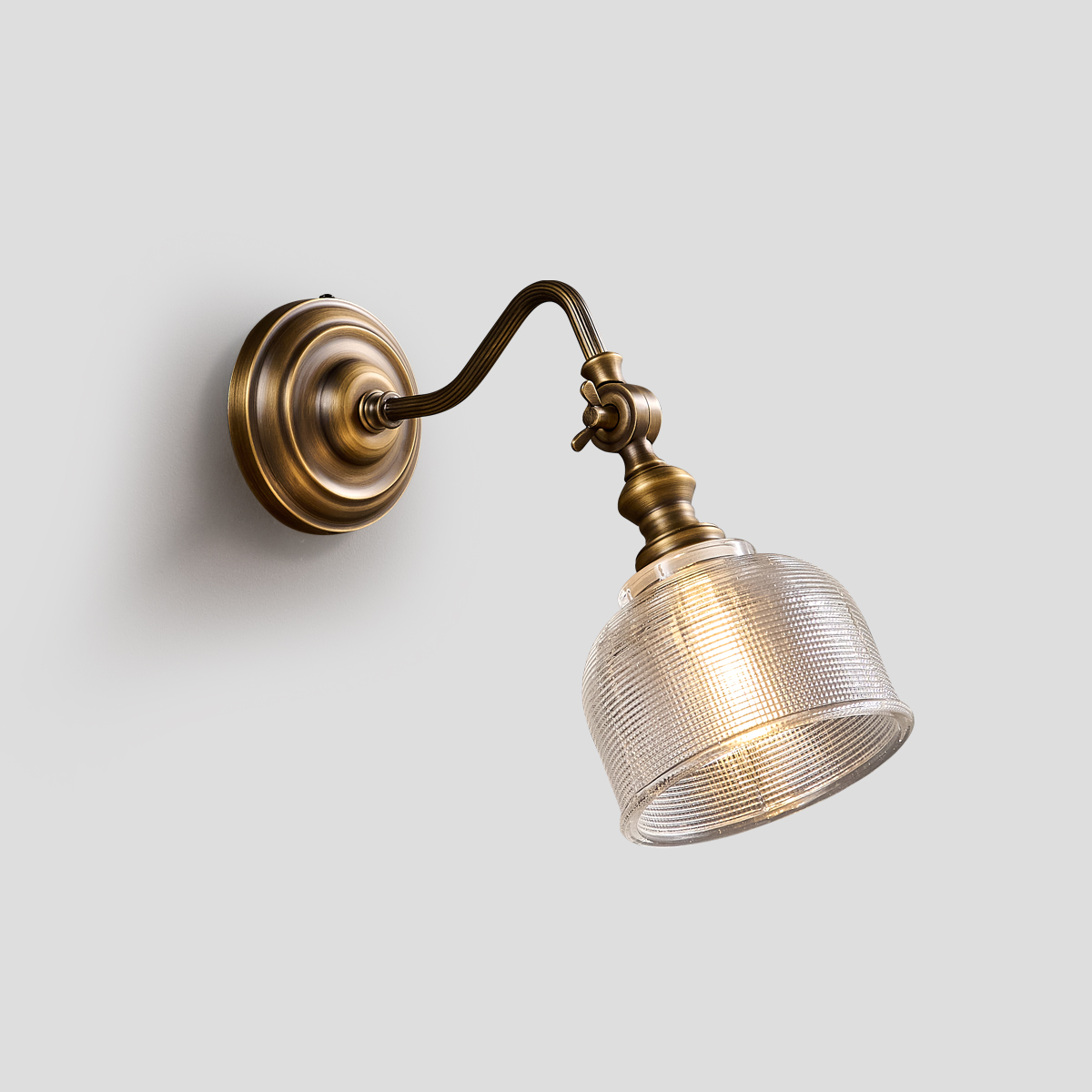 Adjustable Swing Arm Sconce 1 Vintage brass wall light with elegant curved swing arm and textured glass shade - Model B