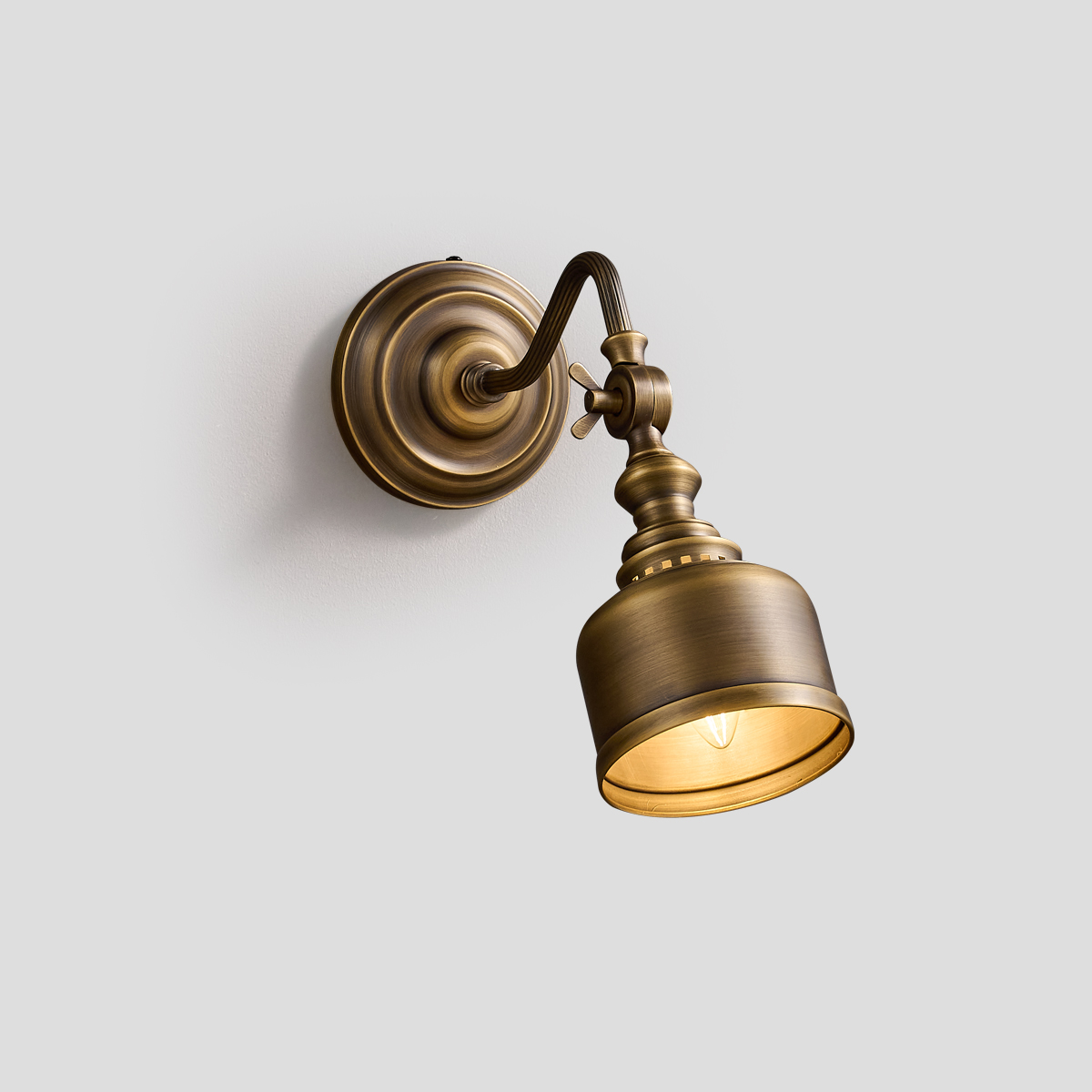 Mid-century Modern Brass Sconce 1 Elegant curved arm mid-century modern brass wall sconce in brushed finish, ideal for gallery or bedside lighting.