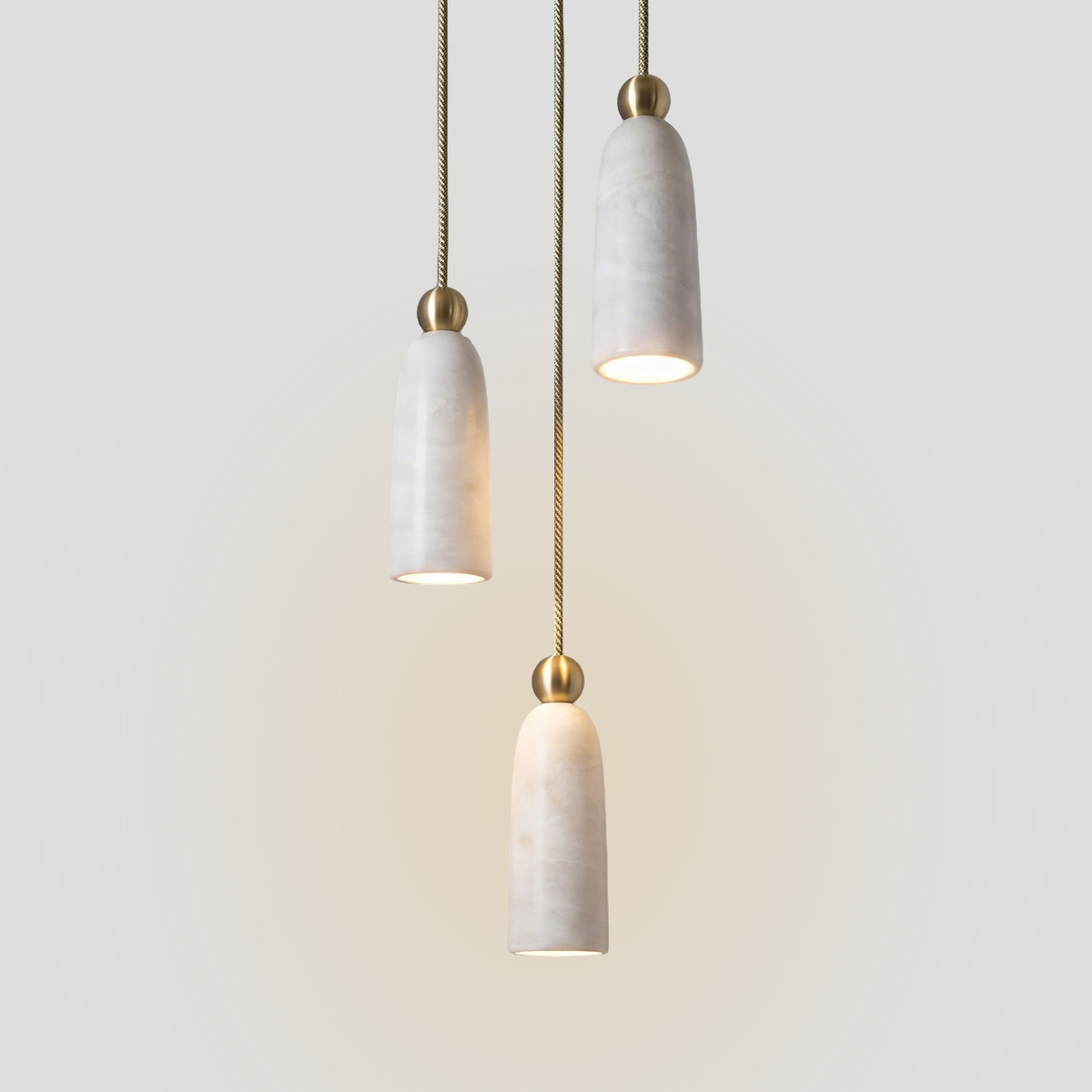 Luxury Alabaster Marble Pendant Light 1 Modern luxury marble pendant light 3-light cluster chandelier with brushed brass details.