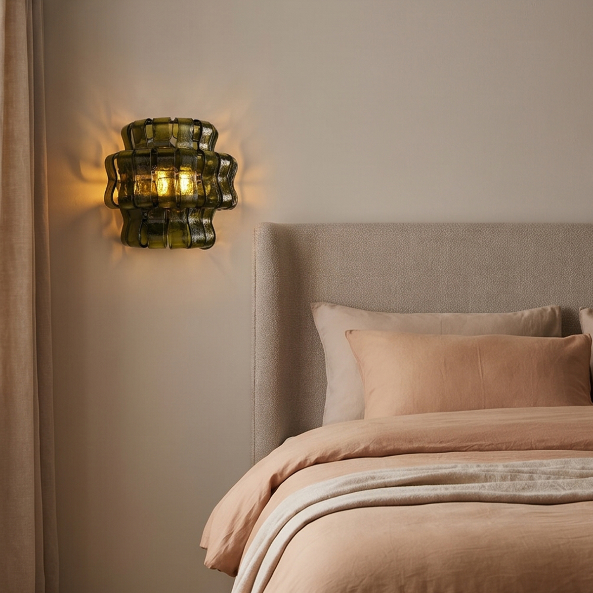Vintage Green Glass Sconce 8 Alt Text: A vintage green glass sconce featuring tiered, wavy olive green textured glass panels emitting a warm glow, mounted on a beige wall.